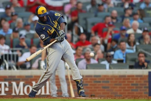 Lorenzo Cain of the Milwaukee Brewers hits an RBI single during the fourth inning against the Atlanta Braves in game four of the National League...