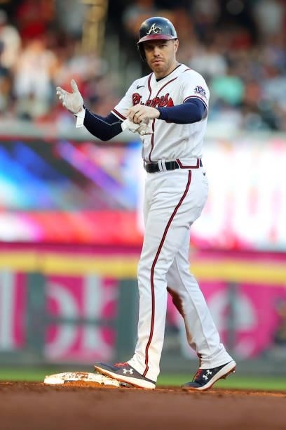 Freddie Freeman of the Atlanta Braves reacts to a double during the third inning in game four of the National League Division Series at Truist Park...