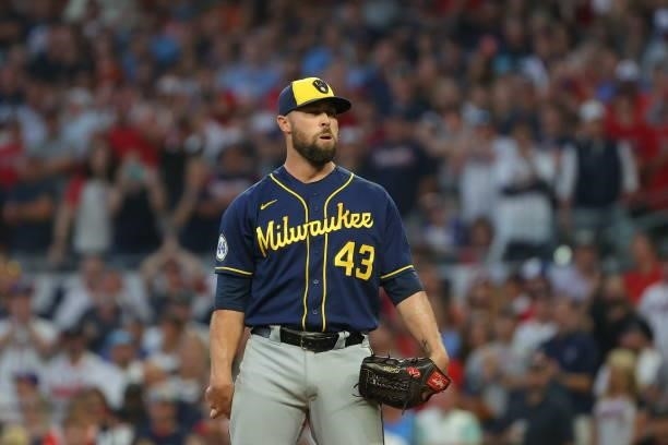 Hunter Strickland of the Milwaukee Brewers takes a deep breath before pitching during the fourth inning against the Atlanta Braves in game four of...