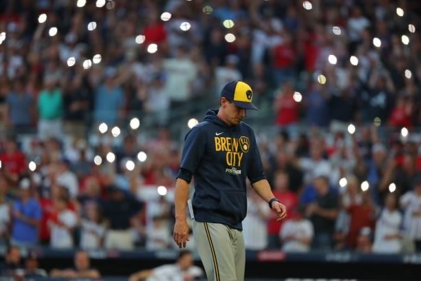 Craig Counsell of the Milwaukee Brewers walks back to the dugout during the fourth inning against the Atlanta Braves in game four of the National...