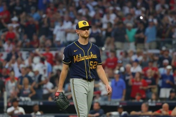 Hunter Strickland of the Milwaukee Brewers heads out of the game during the fourth inning against the Atlanta Braves in game four of the National...