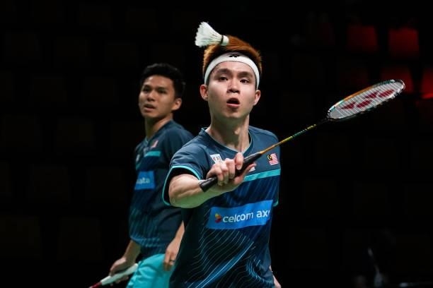 Nur Izzuddin and Soh Wooi Yik of Malaysia compete in the Men's Double match against Phillipe Charron and Maxime Tetreault of Canada during day four...