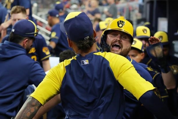 Rowdy Tellez of the Milwaukee Brewers celebrates in the dugout after a two run home run during the fifth inning against the Atlanta Braves in game...