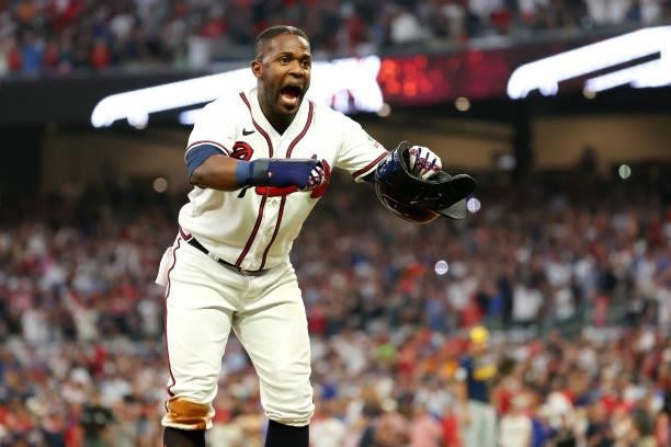 Guillermo Heredia of the Atlanta Braves yells towards the Milwaukee Brewers bench during the fourth inning in game four of the National League...
