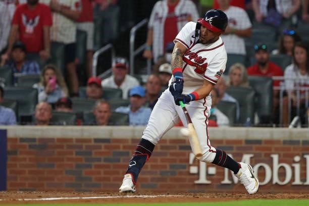 Eddie Rosario of the Atlanta Braves hits a two run single during the fourth inning against the Milwaukee Brewers in game four of the National League...