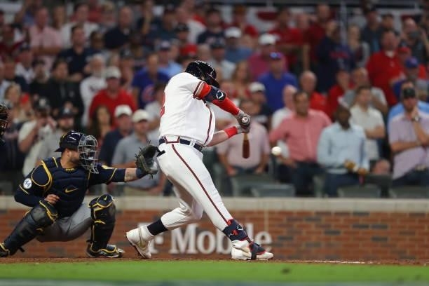 Joc Pederson of the Atlanta Braves hits a single during the fifth inning against the Milwaukee Brewers in game four of the National League Division...