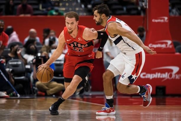 Malachi Flynn of the Toronto Raptors dribbles the ball as Raul Neto of the Washington Wizards defends during the first half at Capital One Arena on...