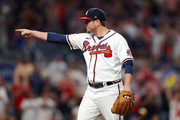 Luke Jackson of the Atlanta Braves reacts to getting out of the 7th inning against the Milwaukee Brewers in game four of the National League Division...