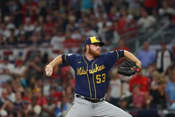 Brandon Woodruff of the Milwaukee Brewers delivers during the seventh inning against the Atlanta Braves in game four of the National League Division...