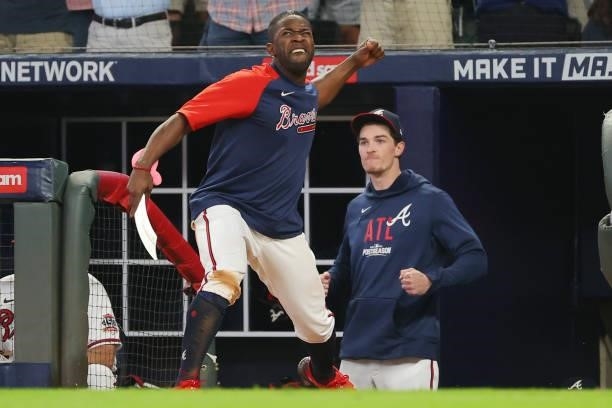 Guillermo Heredia of the Atlanta Braves reacts after Rowdy Tellez of the Milwaukee Brewers strikes out during the seventh inning in game four of the...