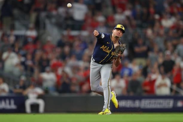 Willy Adames of the Milwaukee Brewers fields a ground ball to get out of the 7th inning against the Atlanta Braves in game four of the National...