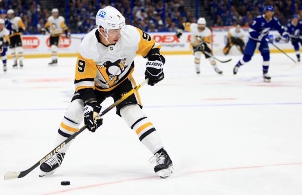 Evan Rodrigues of the Pittsburgh Penguins looks to pass during the first period of a game against the Tampa Bay Lightning at Amalie Arena on October...