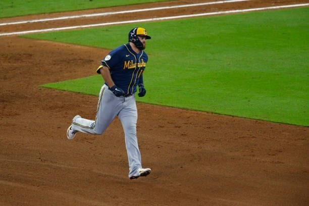 Rowdy Tellez of the Milwaukee Brewers rounds first after hitting a two run home run during the fifth inning against the Atlanta Braves in game four...