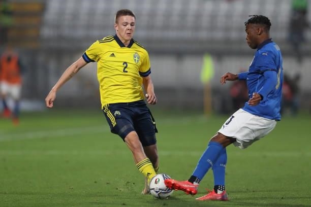 Iyenoma Destiny Uodgie of Italy tackles Emil Holm of Sweden during the 2022 UEFA European Under-21 Championship Qualifier match between Italy and...