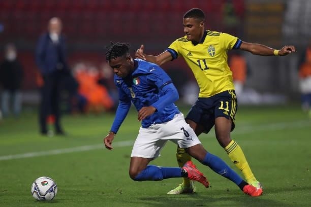 Iyenoma Destiny Uodgie of Italy is bundled over by Amin Sarr of Sweden during the 2022 UEFA European Under-21 Championship Qualifier match between...