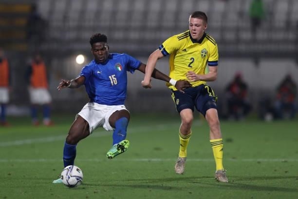 Emil Holm of Sweden clashes with Caleb Okoli of Italy during the 2022 UEFA European Under-21 Championship Qualifier match between Italy and Sweden at...