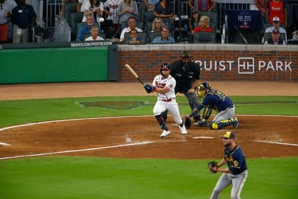 Eddie Rosario of the Atlanta Braves hits a two RBI single during the fourth inning against the Milwaukee Brewers in game four of the National League...