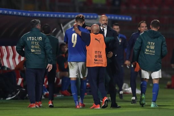 Lorenzo Lucca of Italy is complimented by Vincenzo Pincolini Italy Fitness coach and Mirko Gasparetto Italy Assistant coach as he is substituted...