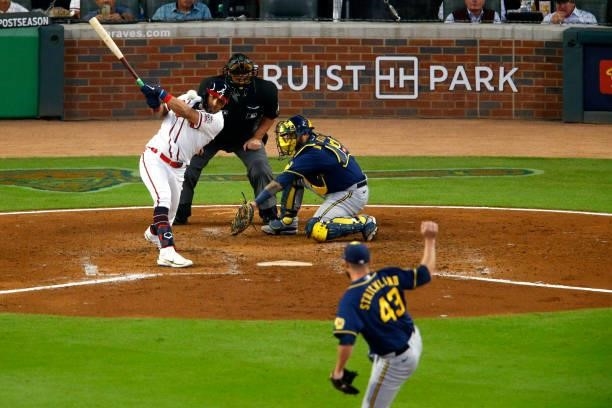 Eddie Rosario of the Atlanta Braves hits a two RBI single during the fourth inning against the Milwaukee Brewers in game four of the National League...