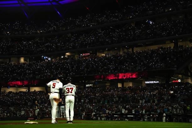 Atlanta Braves fans use cell phone lights during the seventh inning against the Milwaukee Brewers in game four of the National League Division Series...