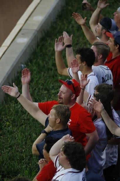 Fans do the chop in game four of the National League Division Series between the Atlanta Braves and the Milwaukee Brewers at Truist Park on October...