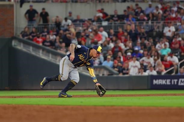 Kolten Wong of the Milwaukee Brewers fields a ball during the sixth inning in game four of the National League Division Series at Truist Park on...
