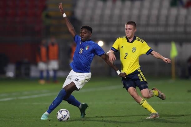 Emil Holm of Sweden clashes with Caleb Okoli of Italy during the 2022 UEFA European Under-21 Championship Qualifier match between Italy and Sweden at...