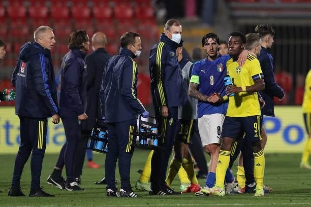 Sandro Tonali of Italy talks with Anthony Elanga of Sweden following the final whistle after the Swedish striker reacted to jeers from fans after his...