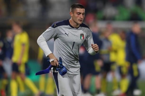Stefano Turati of Italy runs towards the spectators to remove his jersey and leave it as a gift for a fan during the 2022 UEFA European Under-21...