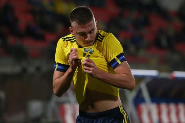 Tim Prica of Sweden kisses the badge on his jersey as he celebrates after scoring a last minute goal to level the game at 1-1 during the 2022 UEFA...
