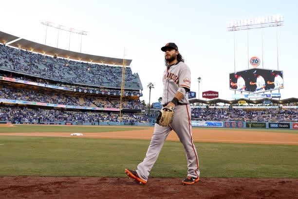 Brandon Crawford of the San Francisco Giants makes his way to the dugout before game 4 of the National League Division Series against the Los Angeles...