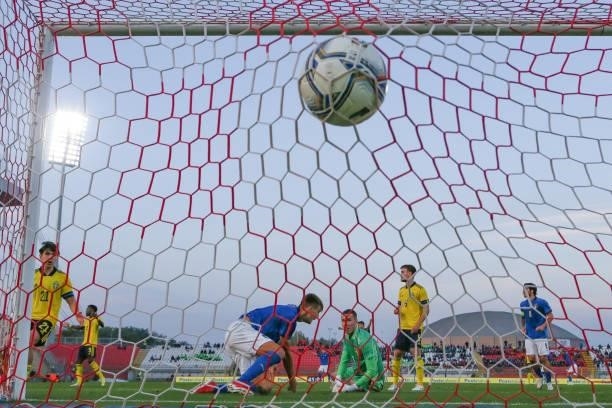 Lorenzo Lucca of Italy fires the ball past Samuel Brolin of Sweden to give the side a 1-0 lead during the 2022 UEFA European Under-21 Championship...