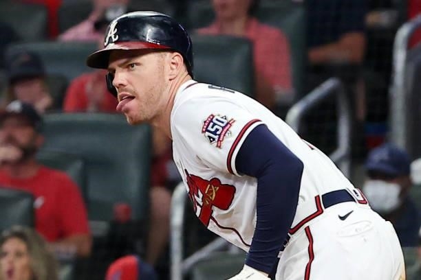 Freddie Freeman of the Atlanta Braves singles during the fifth inning against the Milwaukee Brewers in game four of the National League Division...