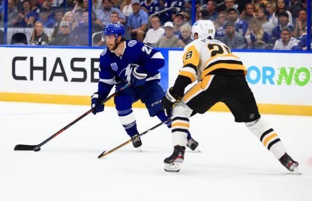 Brayden Point of the Tampa Bay Lightning is defended by Marcus Pettersson of the Pittsburgh Penguins during the second period of a game at Amalie...