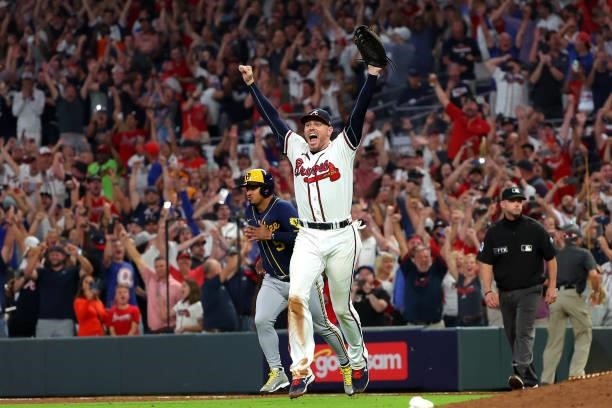 Freddie Freeman of the Atlanta Braves reacts after defeating the Milwaukee Brewers 5-4 in game four of the National League Division Series at Truist...