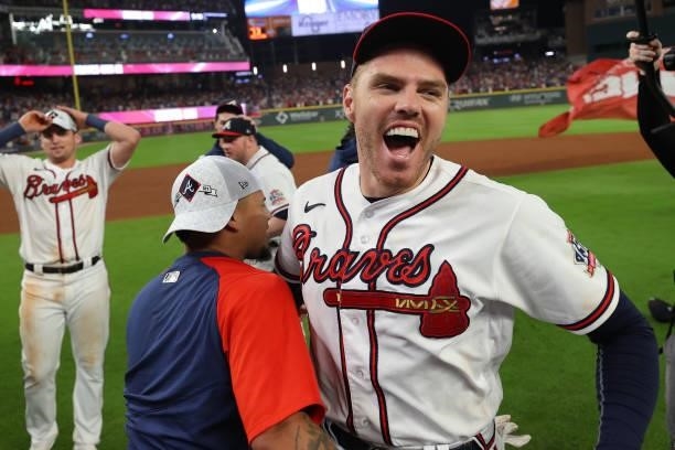 Freddie Freeman of the Atlanta Braves celebrates after defeating the Milwaukee Brewers 5-4 in game four of the National League Division Series at...