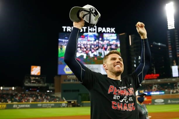 Freddie Freeman of the Atlanta Braves reacts to defeating the Milwaukee Brewers 5-4 in game four of the National League Division Series at Truist...
