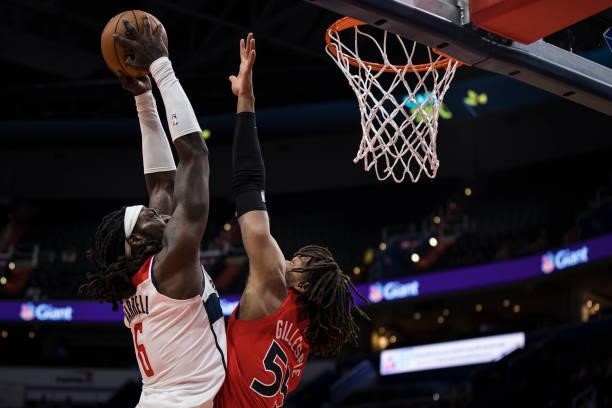 Montrezl Harrell of the Washington Wizards goes to the basket against Freddie Gillespie of the Toronto Raptors during the second half at Capital One...