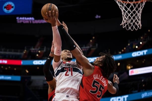 Daniel Gafford of the Washington Wizards goes to the basket against Freddie Gillespie of the Toronto Raptors during the second half at Capital One...
