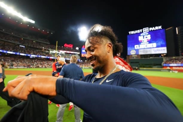 Ozzie Albies of the Atlanta Braves celebrates following the win over the Milwaukee Brewers in game four of the National League Division Series at...