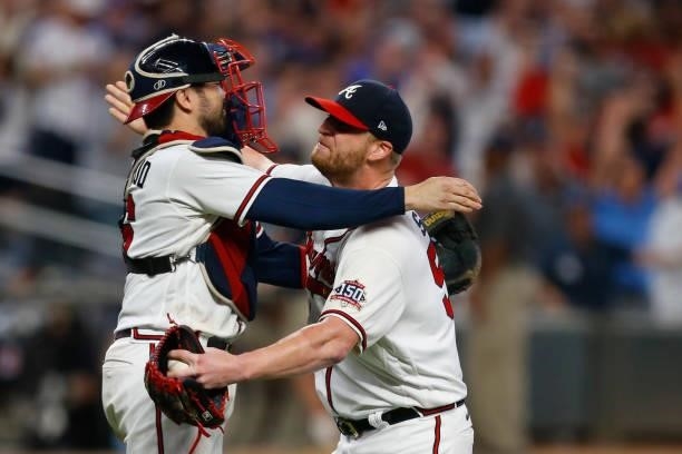 Will Smith of the Atlanta Braves celebrates with Travis d'Arnaud after defeating the Milwaukee Brewers in game four of the National League Division...