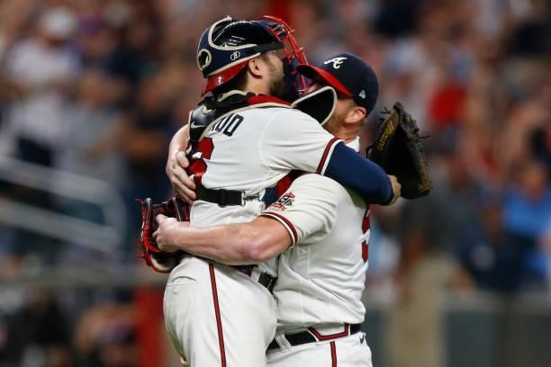 Will Smith of the Atlanta Braves celebrates with Travis d'Arnaud after defeating the Milwaukee Brewers in game four of the National League Division...