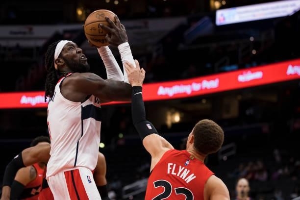 Montrezl Harrell of the Washington Wizards shoots against Malachi Flynn of the Toronto Raptors during the second half at Capital One Arena on October...