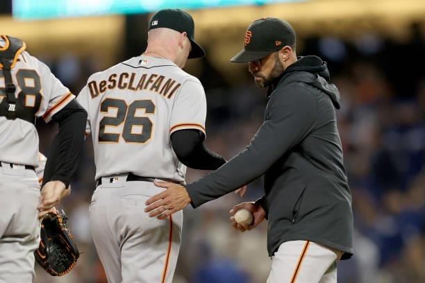 Manager Gabe Kapler takes out Anthony DeSclafani of the San Francisco Giants against the Los Angeles Dodgers during the second inning in game 4 of...