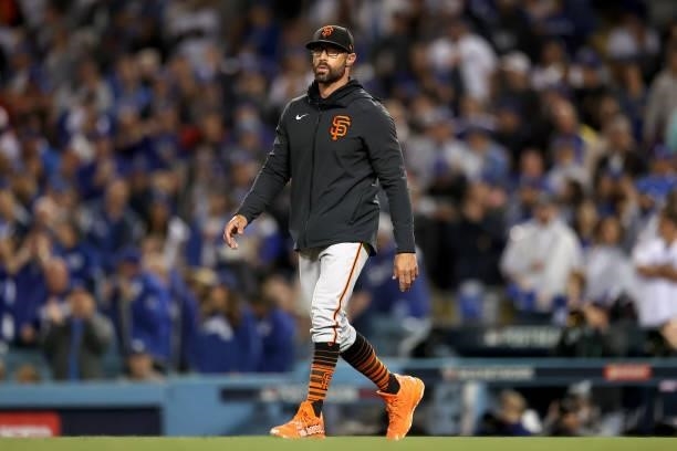 Manager Gabe Kapler of the San Francisco Giants makes a pitching change against the Los Angeles Dodgers during the second inning in game 4 of the...