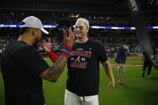 Joc Pederson of the Atlanta Braves celebrates with Eddie Rosario post game following the win over the Milwaukee Brewers in game four of the National...