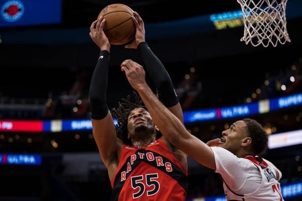 Freddie Gillespie of the Toronto Raptors grabs a rebound in front of Daniel Gafford of the Washington Wizards during the second half at Capital One...