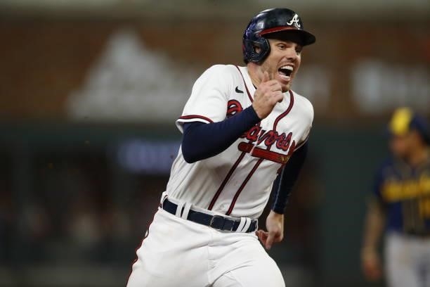 Freddie Freeman of the Atlanta Braves runs to third during the sixth inning in game four of the National League Division Series against the Milwaukee...