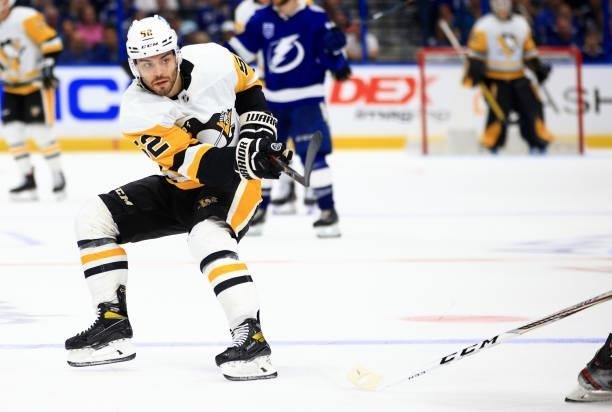 Mark Friedman of the Pittsburgh Penguins passes during the third period of a game against the Tampa Bay Lightning at Amalie Arena on October 12, 2021...