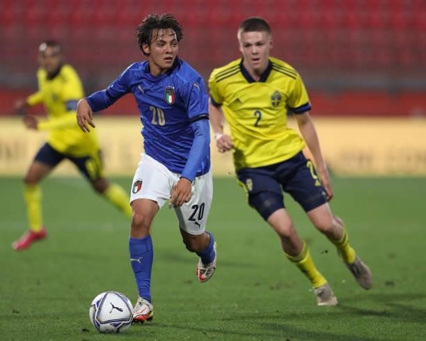 Emanuel Vignato of Italy is pursued by Emil Holm of Sweden during the 2022 UEFA European Under-21 Championship Qualifier match between Italy and...